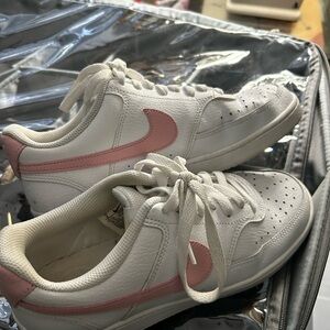Nike Women’s White Sneakers with Pink Swoosh Accent